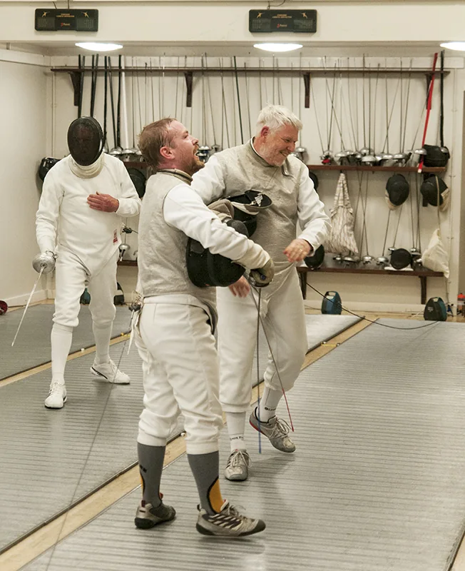 Club members talking between fencing bouts