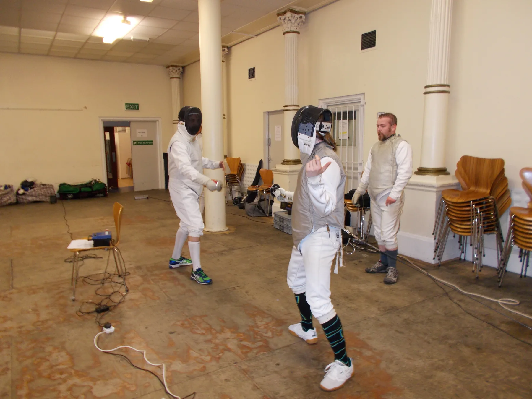 Two club members preparing to fence