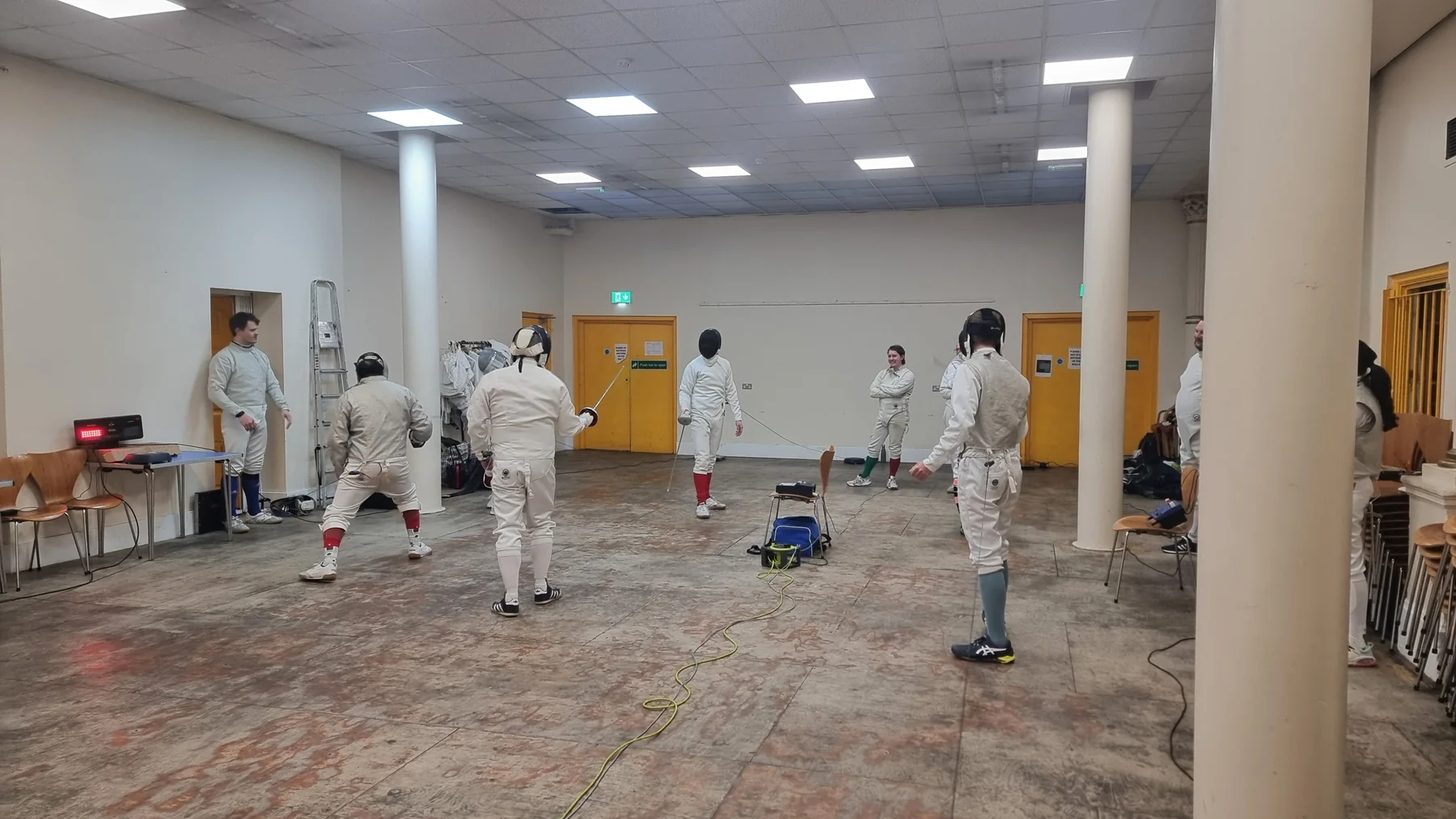 Several club members practising fencing together